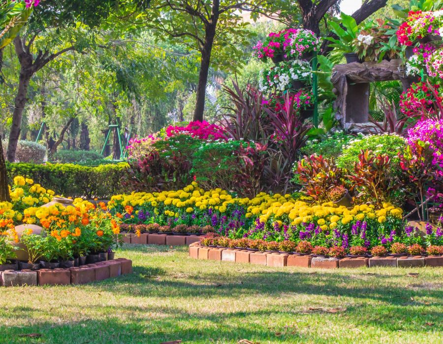 Landscaped flower garden with lots of colorful blooms.